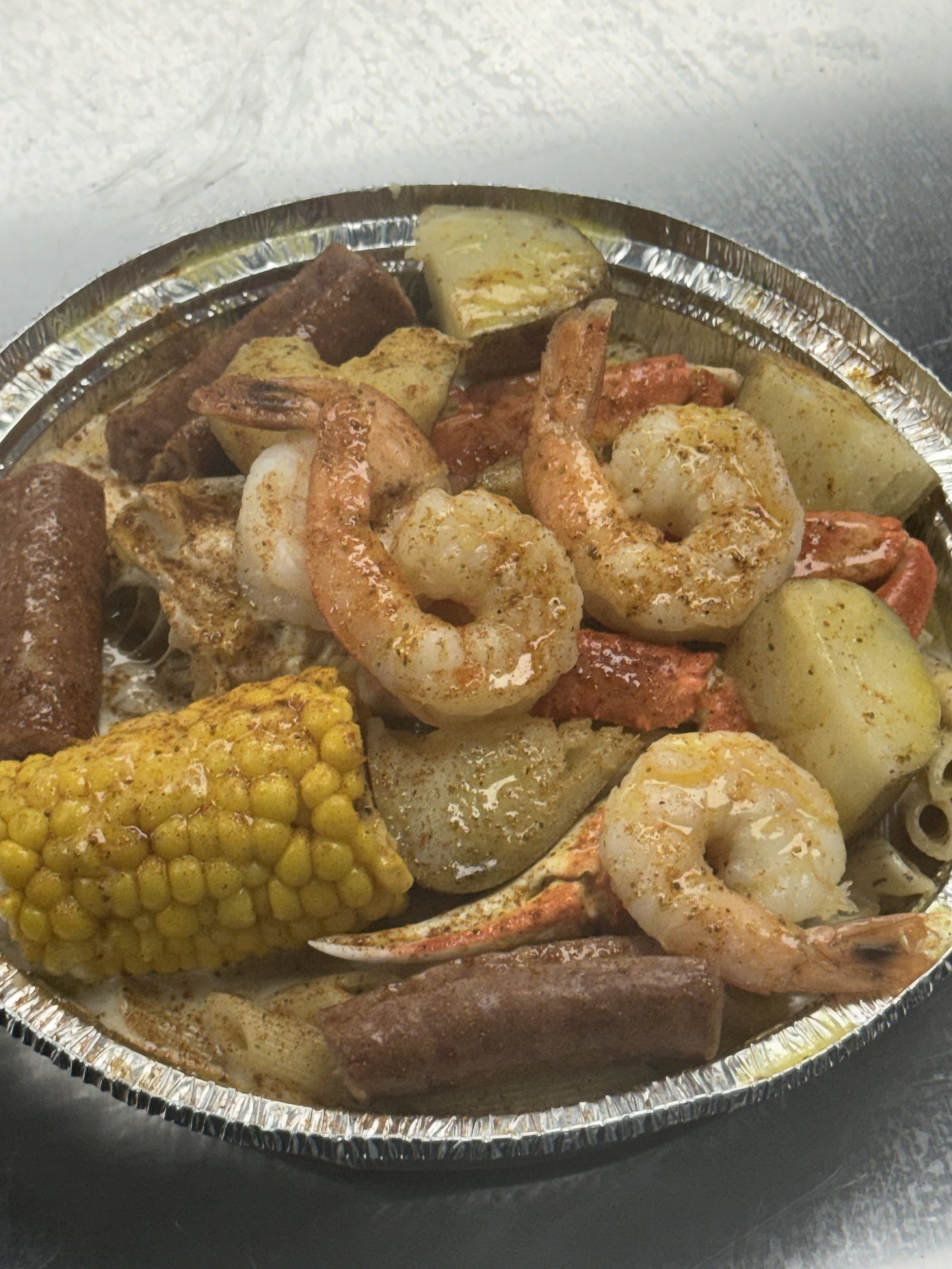 Seafood boil with shrimp, crab, sausage, corn and potatoes