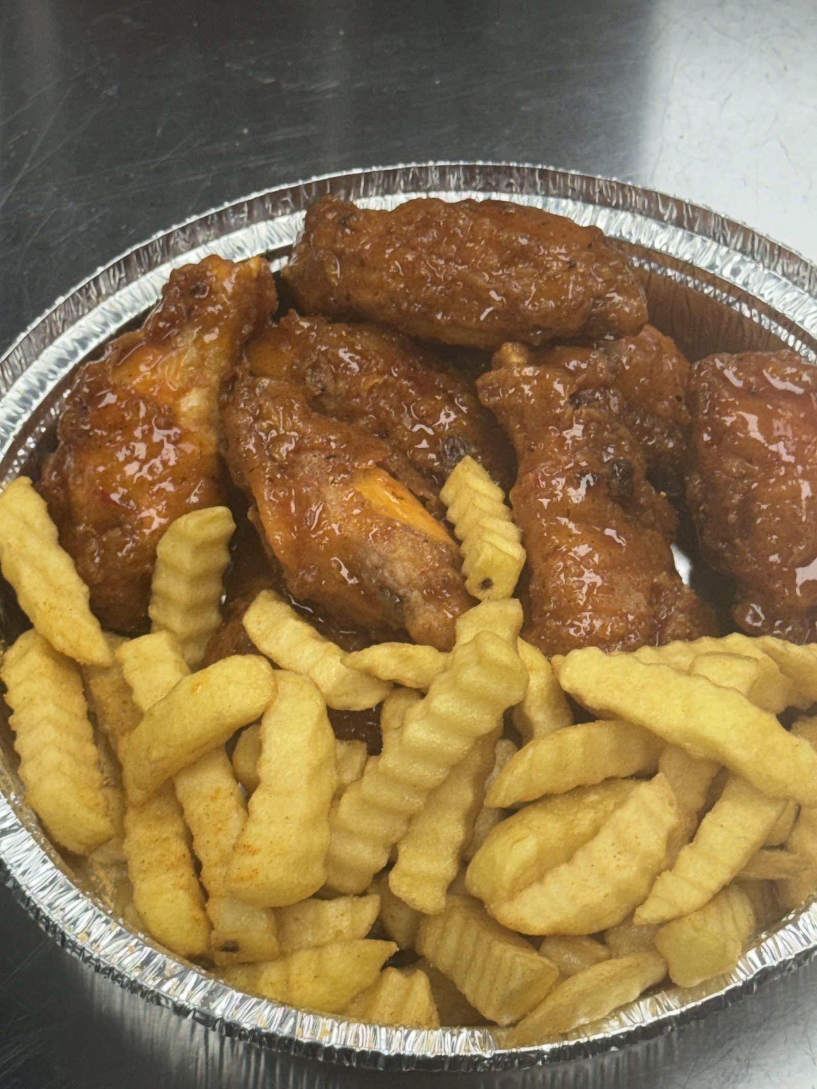 Honey hot glazed wings with seasoned crinkle-cut fries